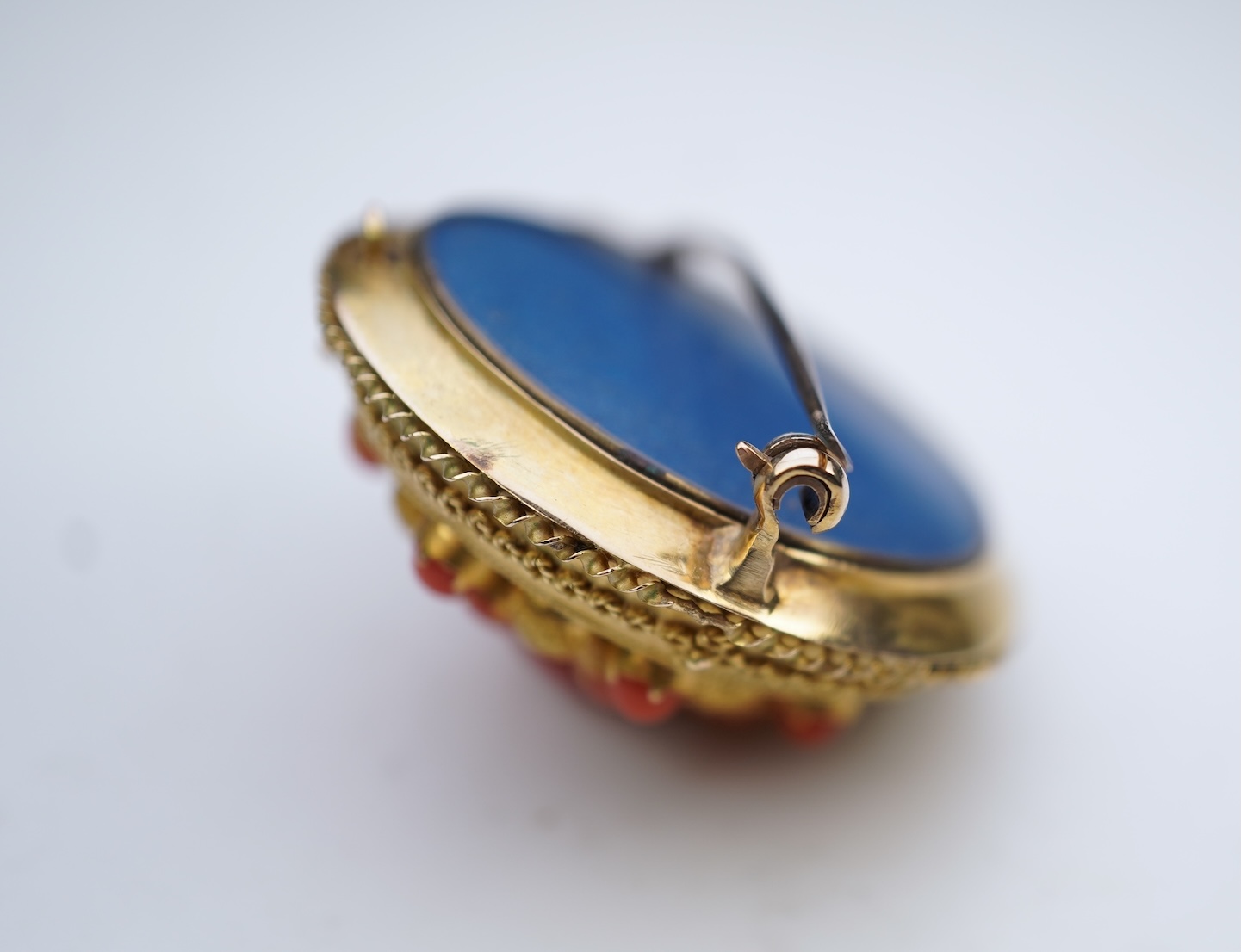 A Victorian gold and coral brooch, late 19th century